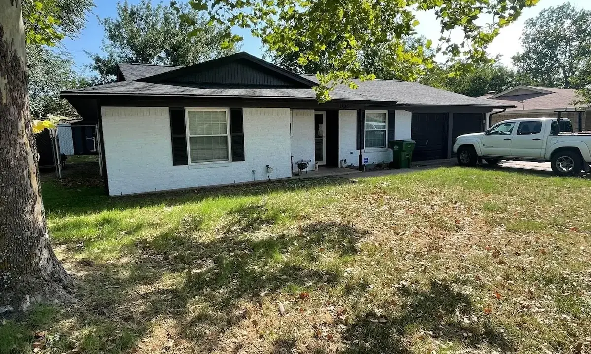 Professional roofing crew working on a residential roof in Rialto